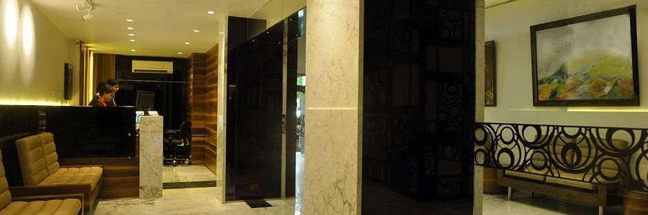 a corridor with sofas at Hotel Diplomat