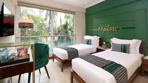 twin beds at the private 4 bedroom suite in bandra - theory9 service apartments