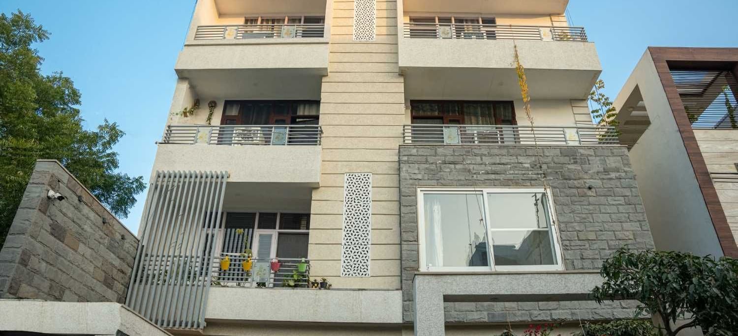 Exterior view of the modern multi-storey homestay building showcasing its contemporary design at Jaypore360 Homestay.