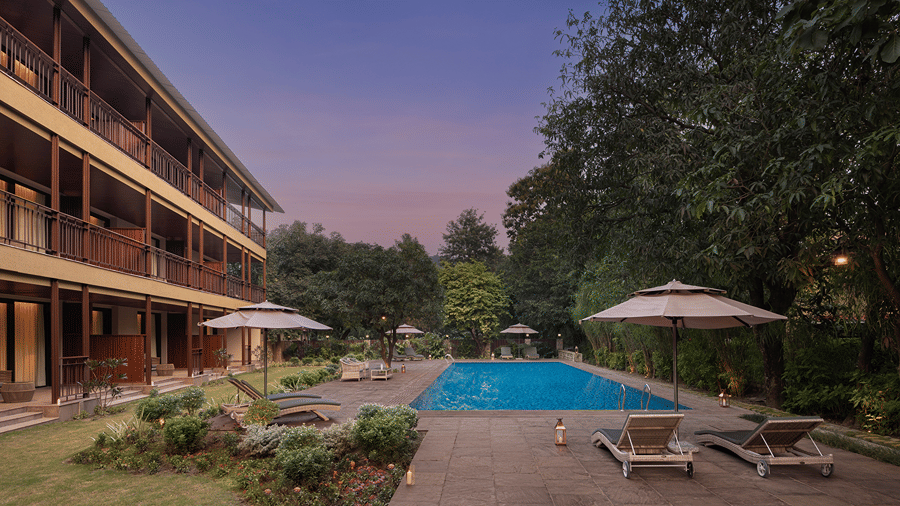 Resort building with guest rooms, landscaped gardens and a swimming pool at The Riverview Retreat, Corbett.
