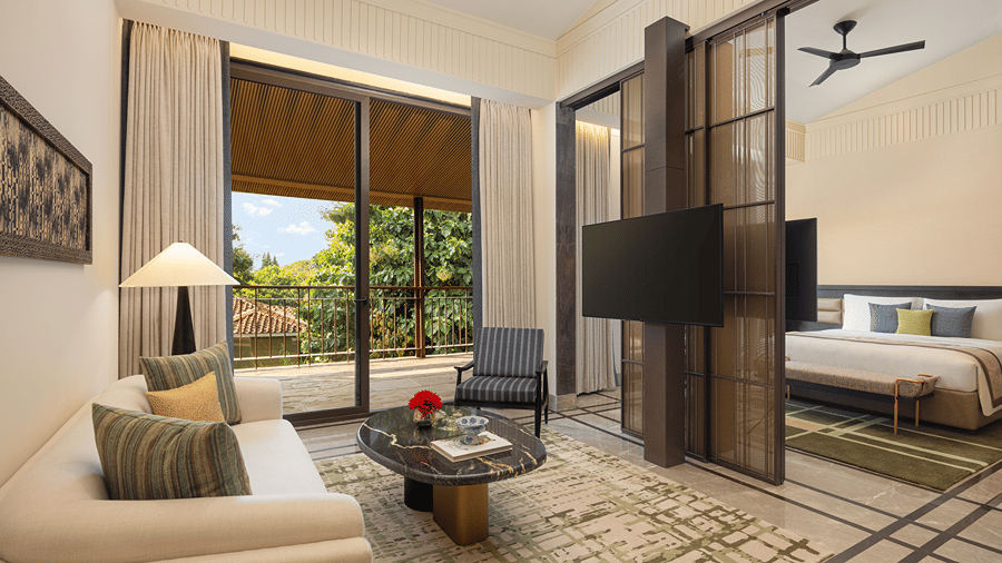Living area of the Sanctuary Suite at The Riverview Retreat, Corbett, with a sofa, coffee table and views of the outdoors.