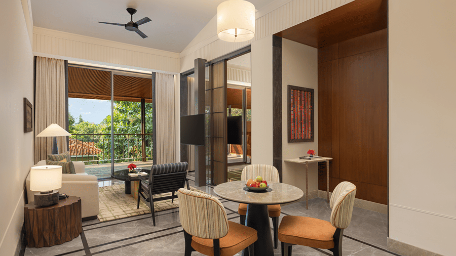 Living and dining area of the Sanctuary Suite at The Riverview Retreat, Corbett, with lounge seating and a dining table.