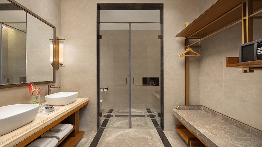 Washroom in the Sanctuary Suite at The Riverview Retreat, Corbett, featuring a vanity, walk-in shower and storage shelves.