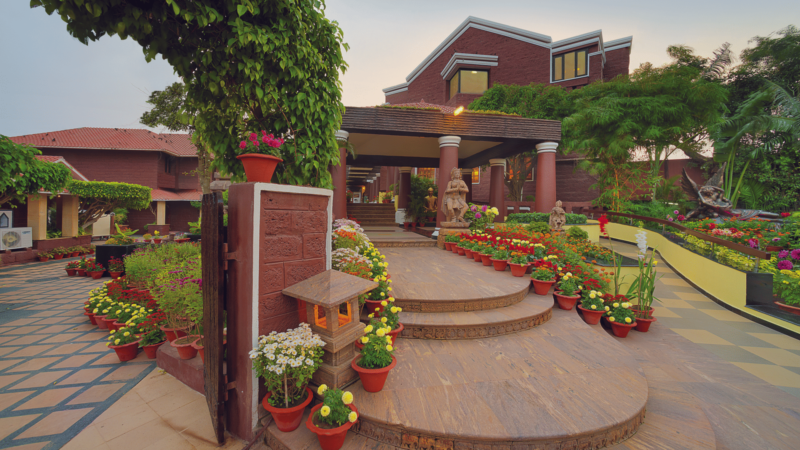 Elegant main entrance of MAYFAIR Heritage hotel showcasing colonial architecture in Puri