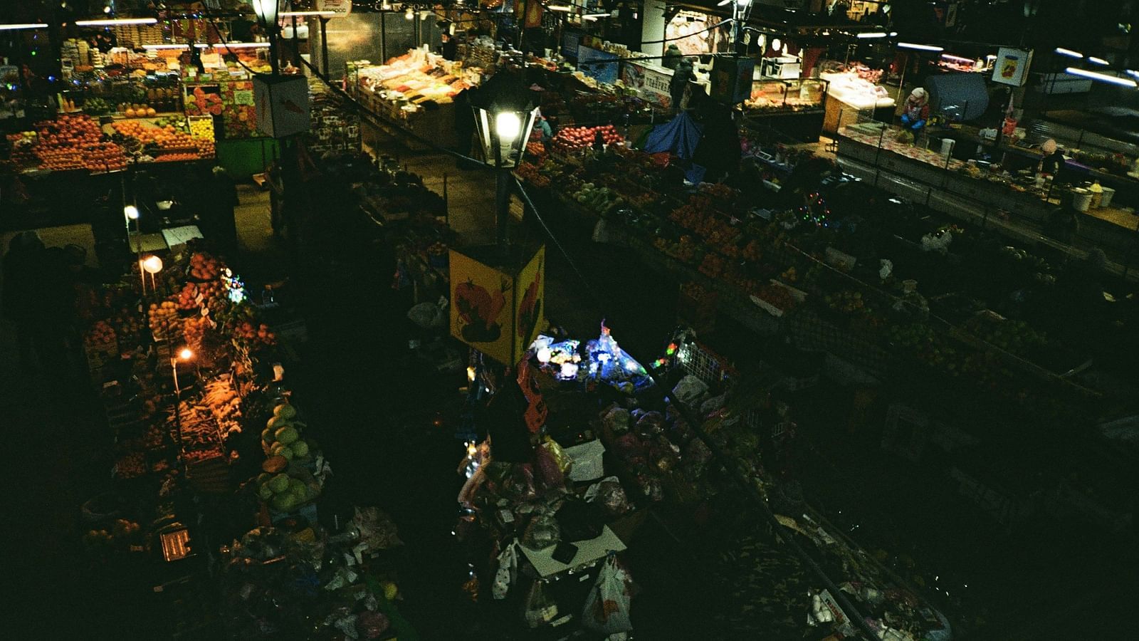 An overview of a night market with many shops selling different items.