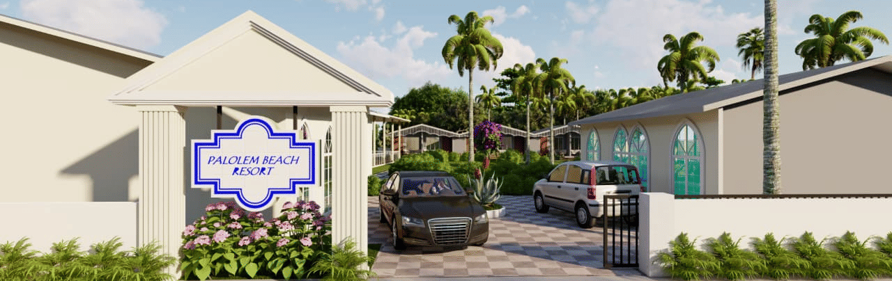 The entrance to Trishvam Palolem Beach Resort, Goa's property featuring a white decorative wall and black car parked outside.