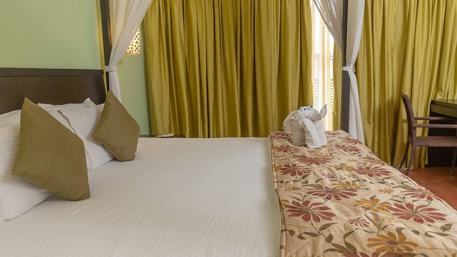 View of a king size bed in the Superior room at Kyriad Prestige Calangute, Goa