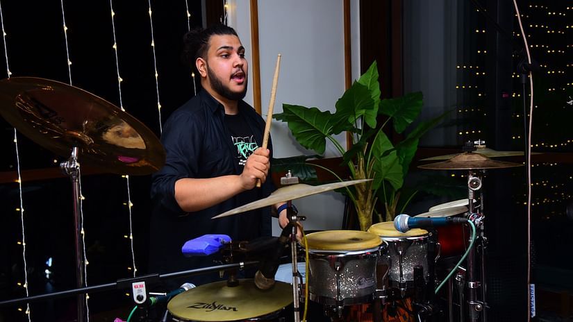 A side close view of the drummer performing at Cloud9 Sarovar Premiere, Palolem Goa.