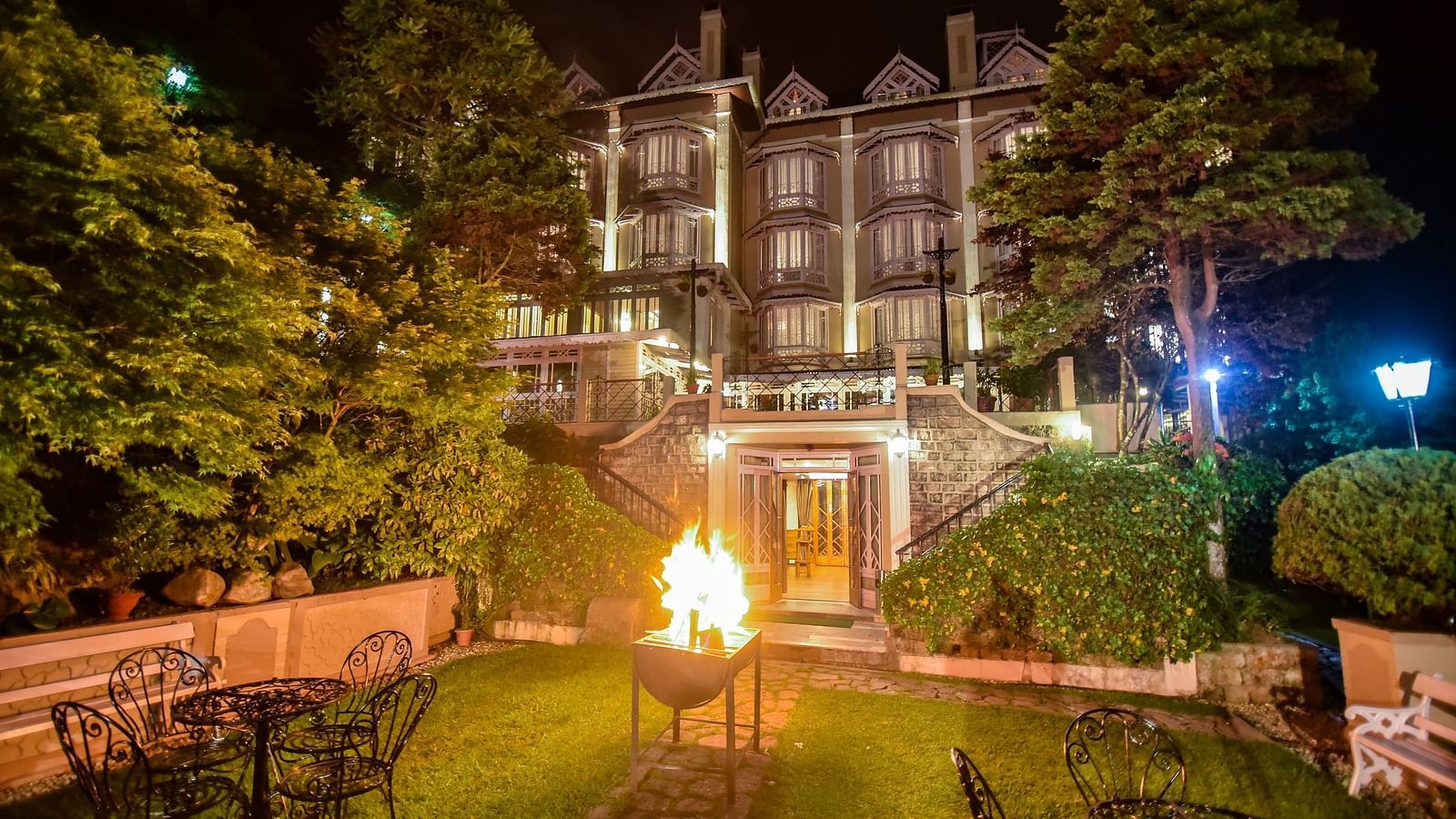 Night view of Cedar Inn building with illuminated entrance