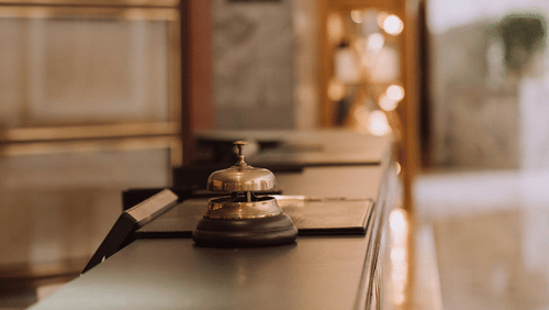 An image of a bronze bell placed on a table