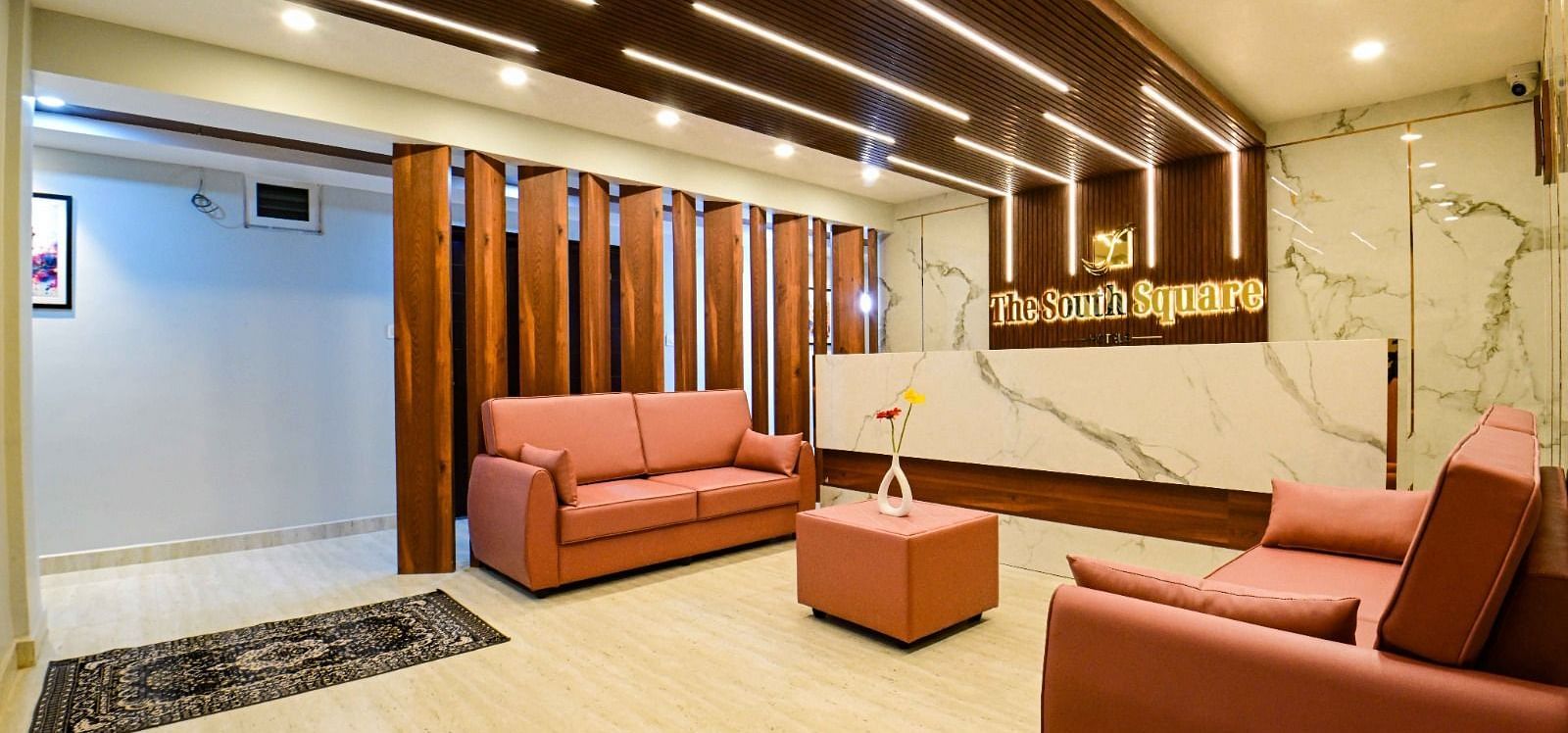 lobby area with comfortable seating of  South Square Hotel, Bengaluru