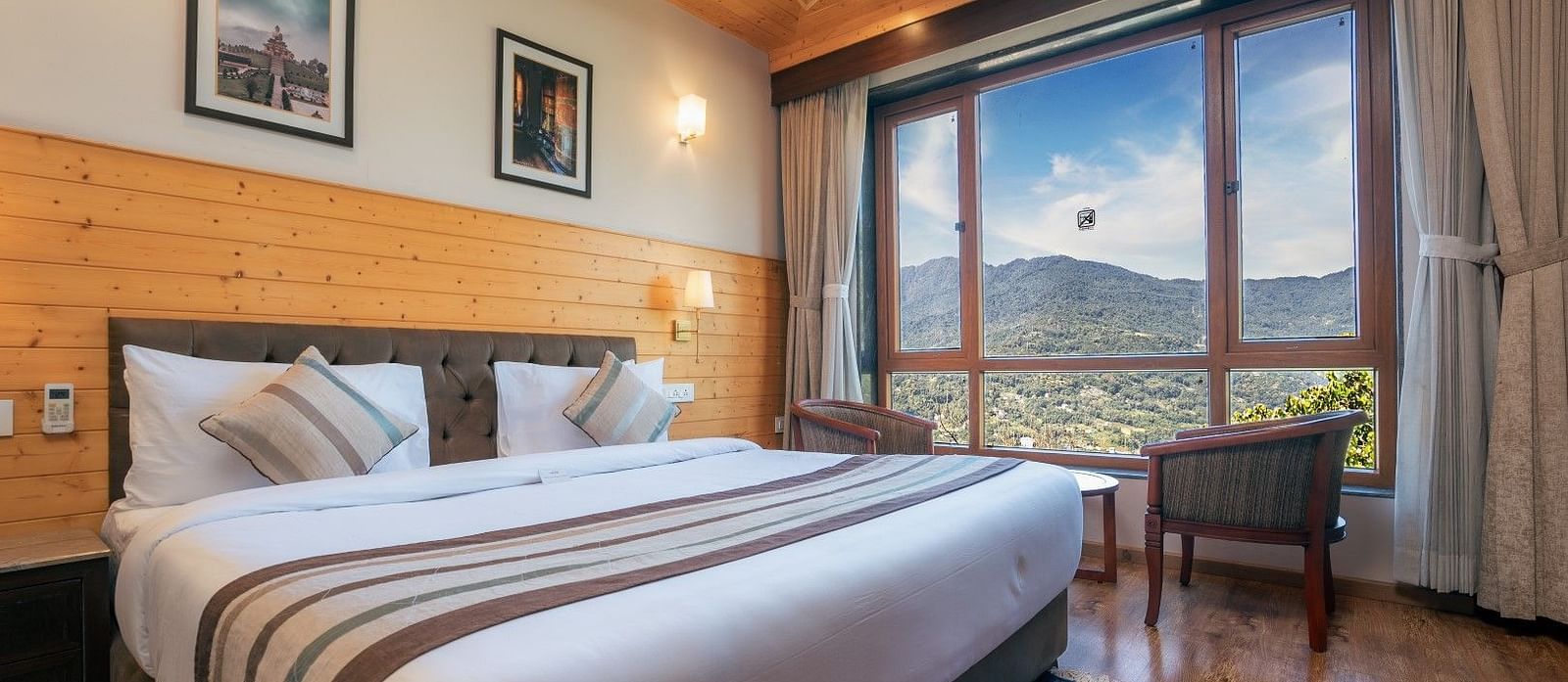 A room at Summit Alpine Abode with a double bed and mountain views