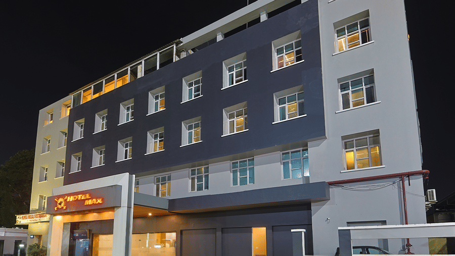 Night view of Max Hotel Prayagraj exterior with lit entrance.