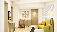 Suite room with a separate sitting area and TV -  Sarovar Portico Srinagar