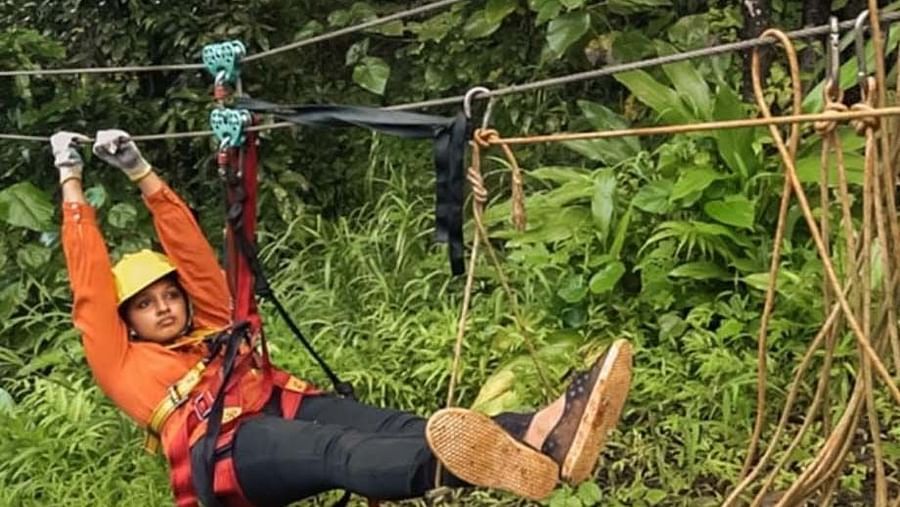 a person zip lining at Holistic Stay Eco Resort, Kannur