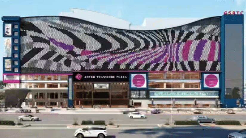 A front exterior view of Arved Plaza, featuring vibrant colors and prominent advertising hoardings that enhance the lively atmosphere of the area.