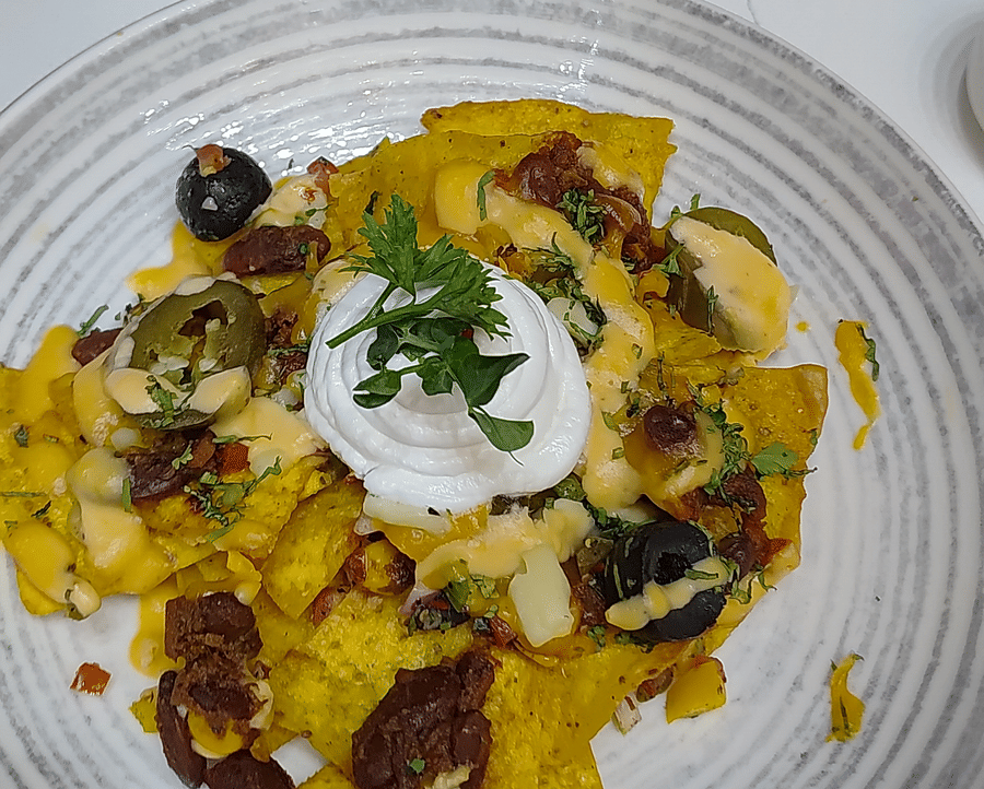 Several types of appetisers placed on plates at The Wild Fork restaurant in La Marvella, Bengaluru. 