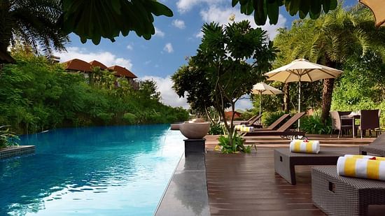 Palm Deck with the swimming pool on one side and a deck on the other -  Ananta Udaipur