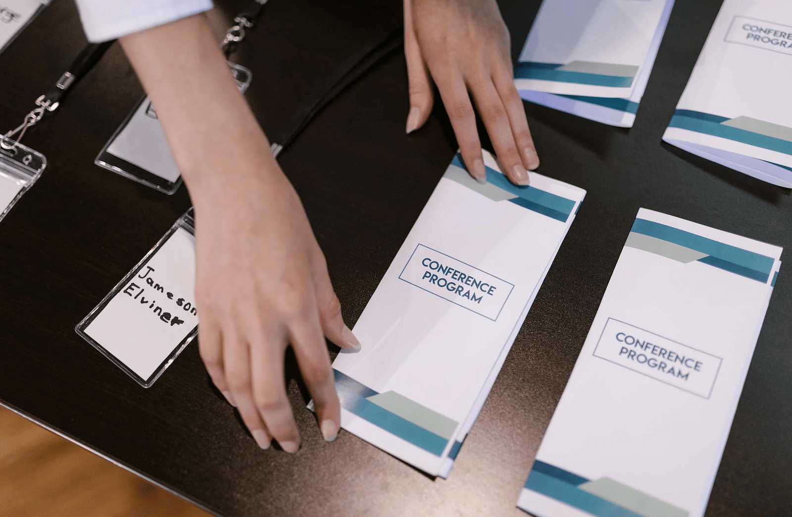 Top view of a table with brochures arranged on it.