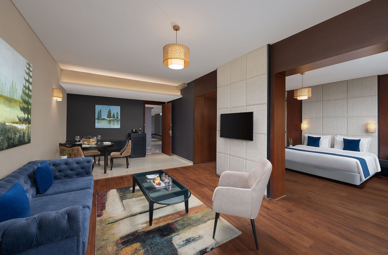 Living room area of Execuitve Suite at Essentia Luxury Hotel, Indore with sofa seating and coffee table set up.