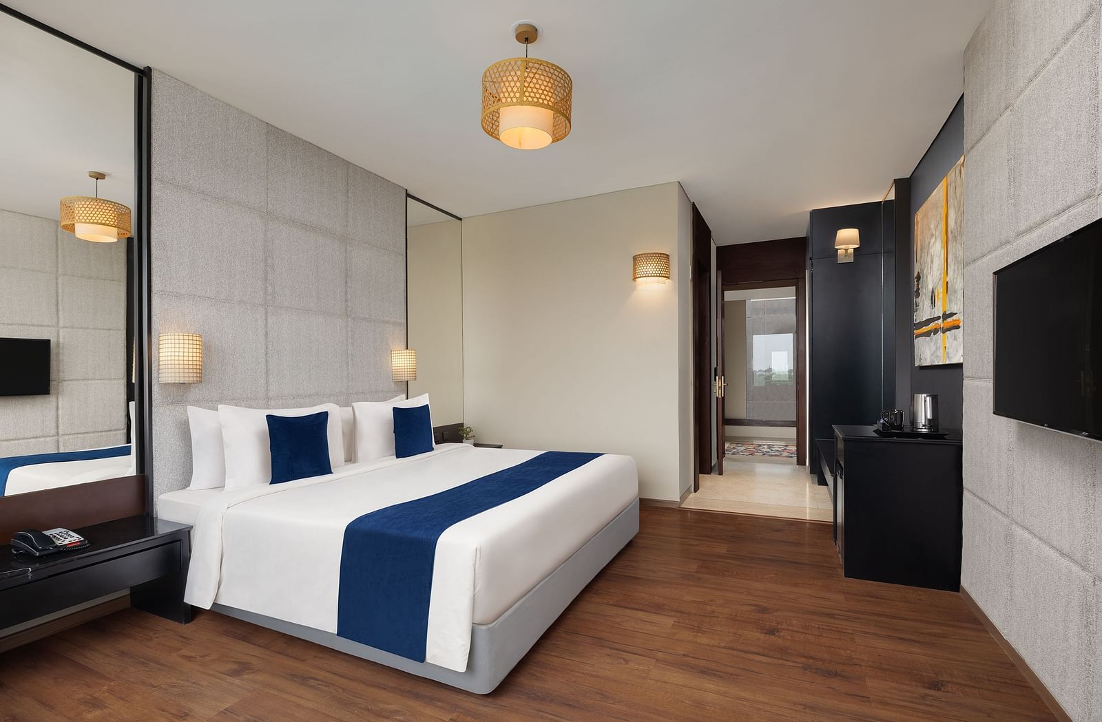 Premium Room at Essentia Luxury Hotel, Indore with a double bed and a television