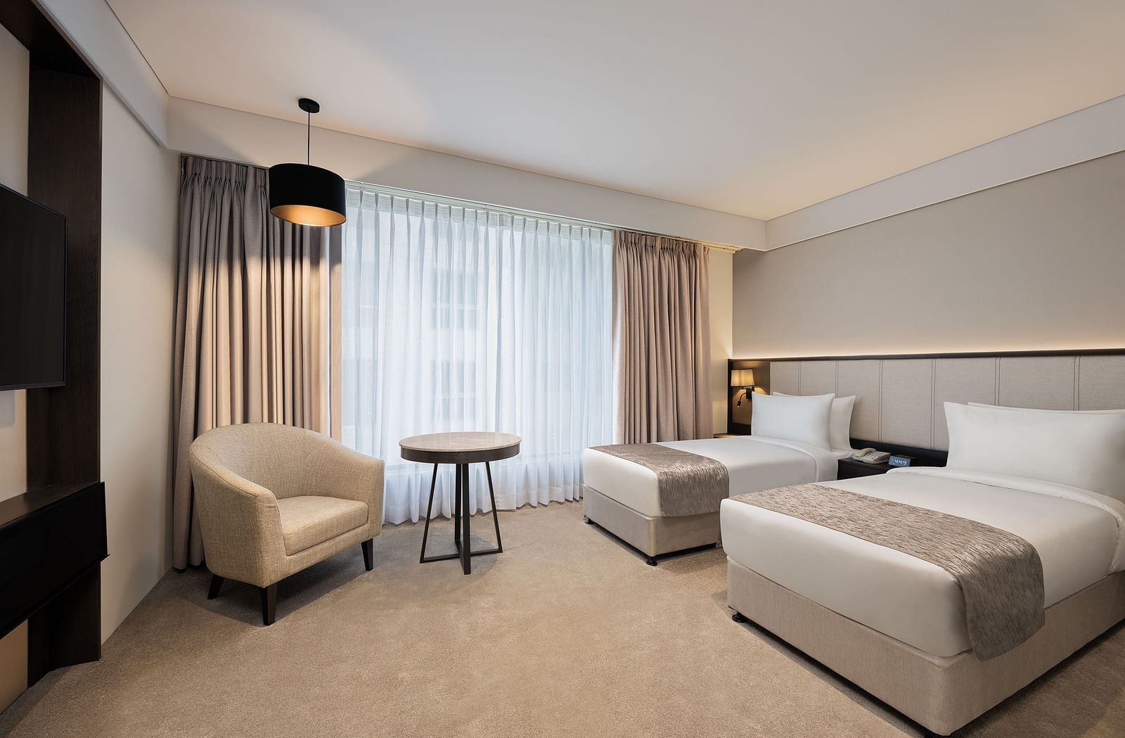 Deluxe Twin Room with twin beds at Essentia Premiere, Pune. 