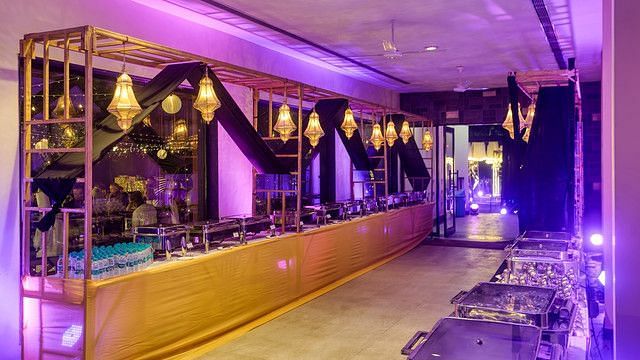 alt-text Banquet hall with tables set for a formal event.