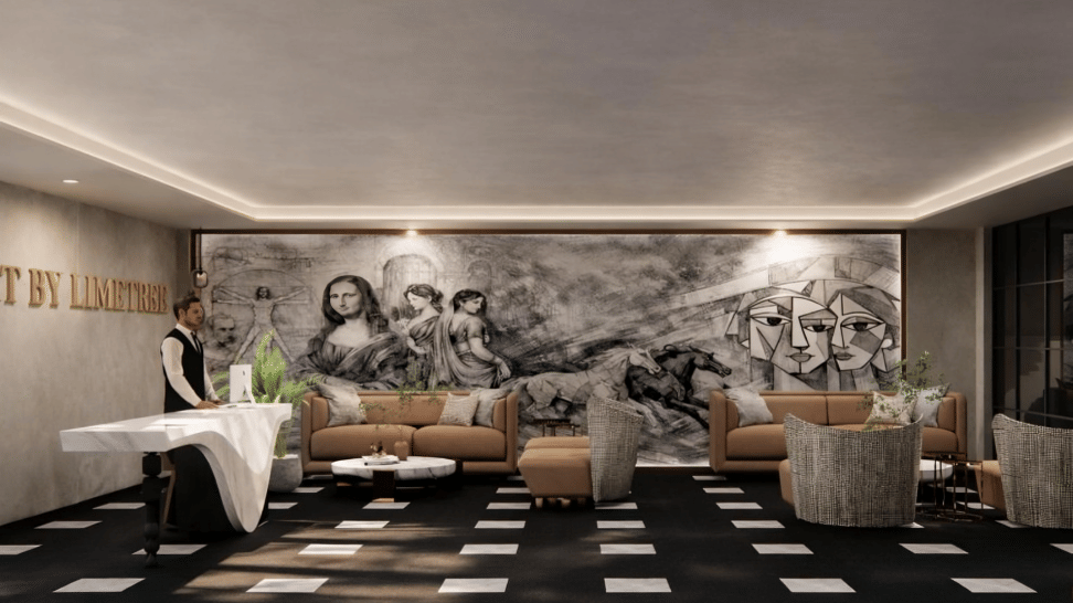 Lounge area of Lime Tree Hotels & Service Apartment Private Limited featuring a black and white mural, checkered flooring, and white sofas arranged around a central table.