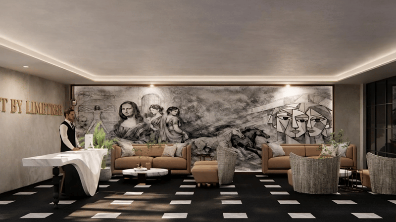 Lounge area of Lime Tree Hotels & Service Apartment Private Limited featuring a black and white mural, checkered flooring, and white sofas arranged around a central table.