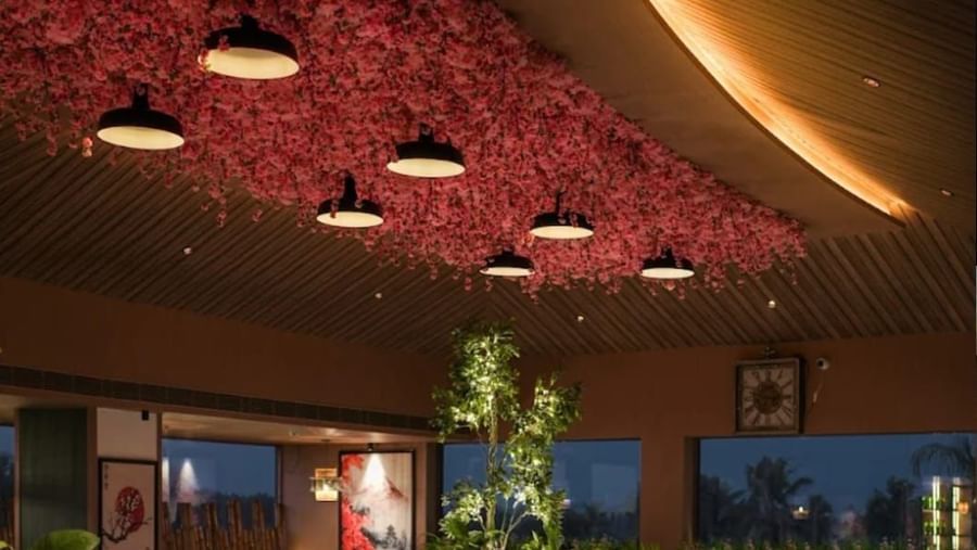 Indoor dining space at Hanami, Uday Suites, featuring elegant decor and spacious seating arrangements.