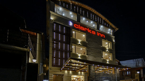 facade of well-lit Clarks Inn, Near Lal Chaulk during night time 