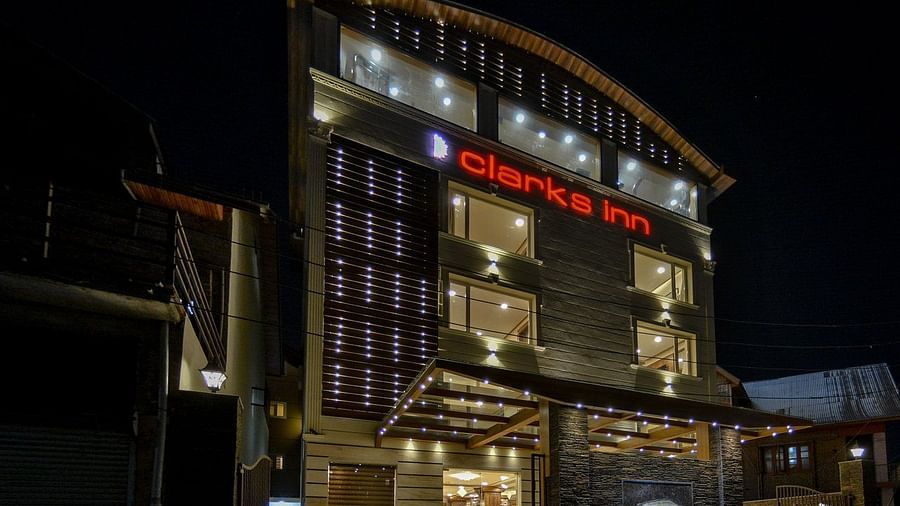 facade of well-lit Clarks Inn, Near Lal Chaulk during night time 