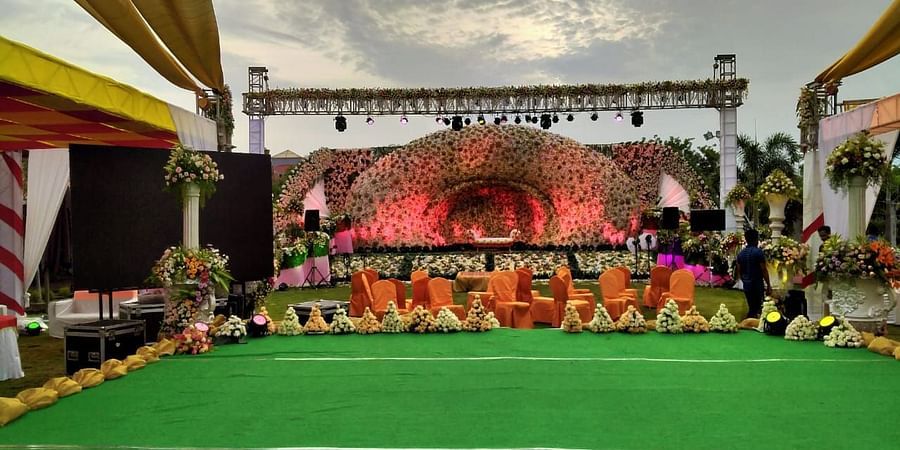 Grandly decorated customisable event space on the lawn with stage setup at GK Hill View Resort.