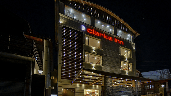 facade of well-lit Clarks Inn, Near Lal Chaulk during night time 