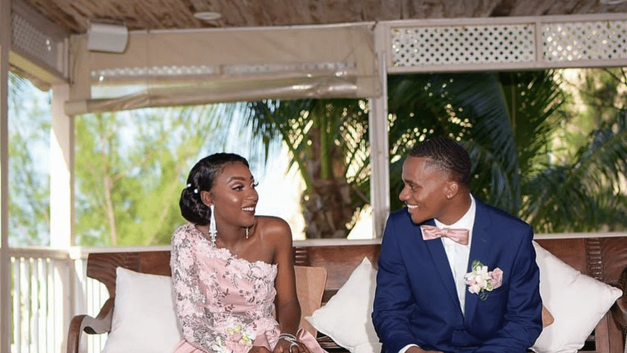 A couple sitting on a bench in a gazebo, both dressed in wedding attire | A Stone's Throw Away