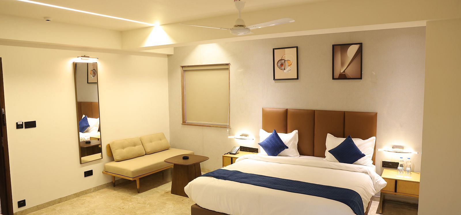A well appointed bedroom at Lords Eco inn Jamnagar Maheshwari Nagar featuring a large bed and elegant decor.