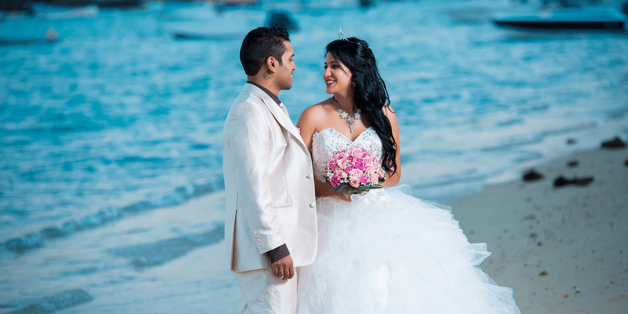 Newlyweds standing on a beach during their destination wedding in Andaman