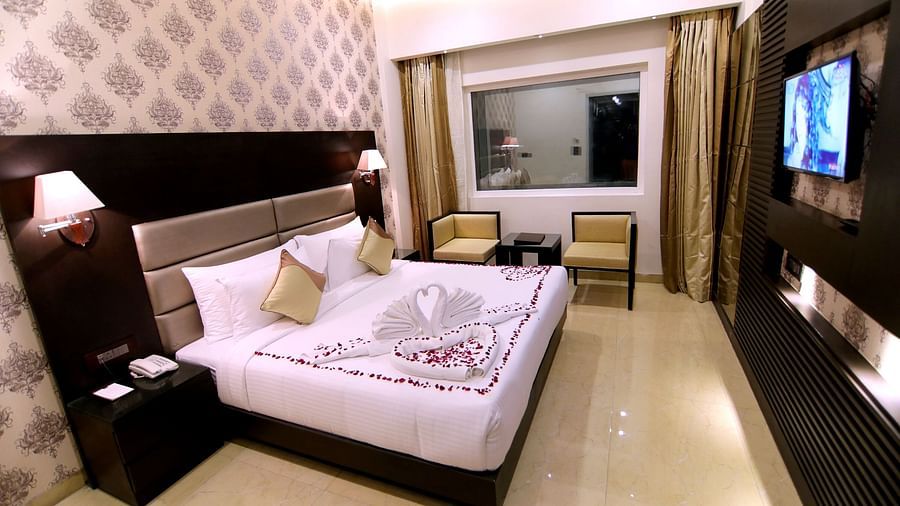 Deluxe Room features lush bedding and aesthetic walls 2 - Udman Hotel Haridwar