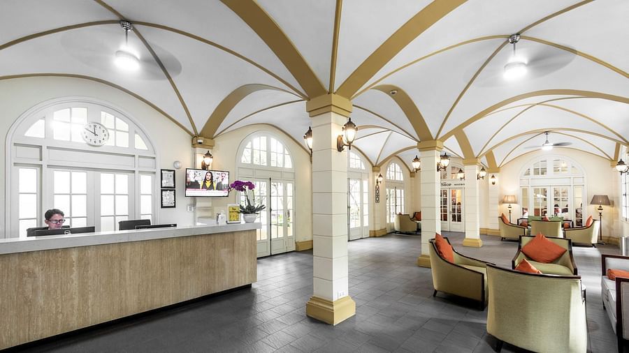 An interior shot of a lobby with high, arched ceilings and elegant furniture | Central Mansions, Phnom Penh