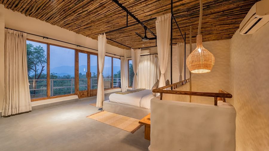 bedroom with large windows, natural wood accents, and minimalistic decor.