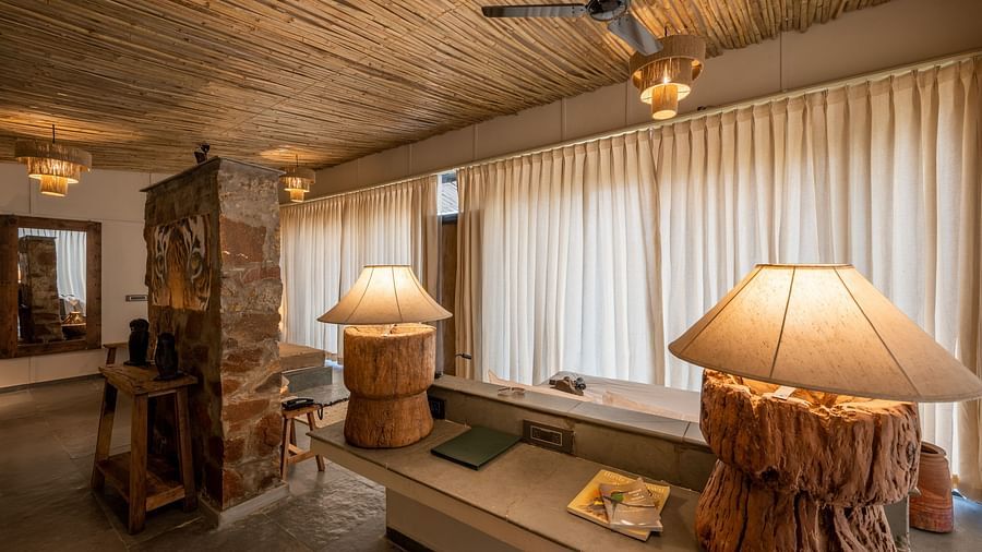 An image of a room with bright lighting and decorative lamps - Utsav Camp Sariska