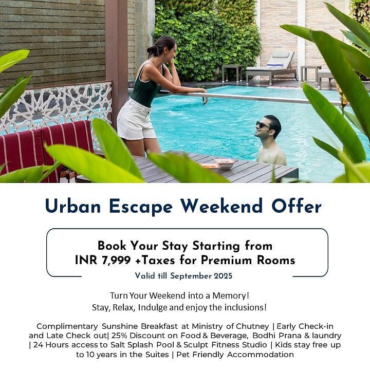 Creative lifestyle photography capturing a couple enjoying leisure time by a private pool surrounded by lush green walls and tropical plants, demonstrating the urban escape weekend offer's relaxing poolside amenities and serene atmosphere.