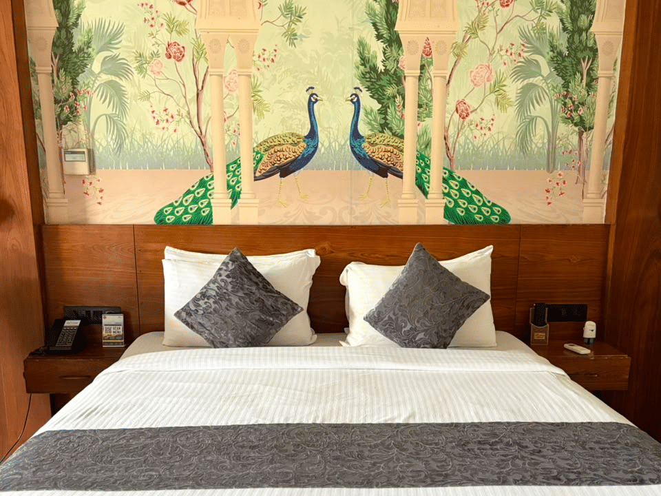 Skyline by Miraya, Emperor Suite, Peacock mural headboard and bedside lamps