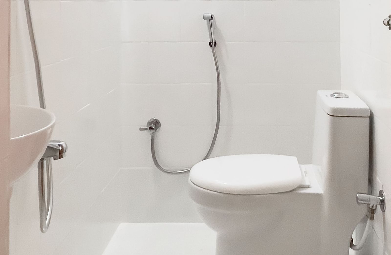Clean bathroom with toilet and shower area at The Pinnacle, Electronic City.