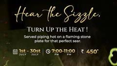 Promotional food poster for Pride Hotel Nagpur featuring a sizzling hot plate with meat and fries, tagline Hear The Sizzle Turn Up The Heat, priced at Rs 450 available from 1pm to 11pm.