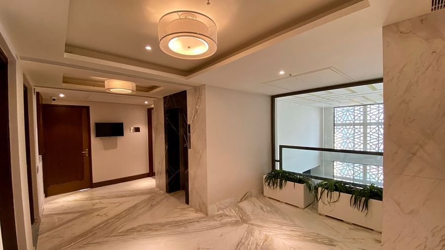 An image of a Banquet Hall with decorative lighting hanging from the ceiling - Hideaway banquets & Lawns, Greater Noida