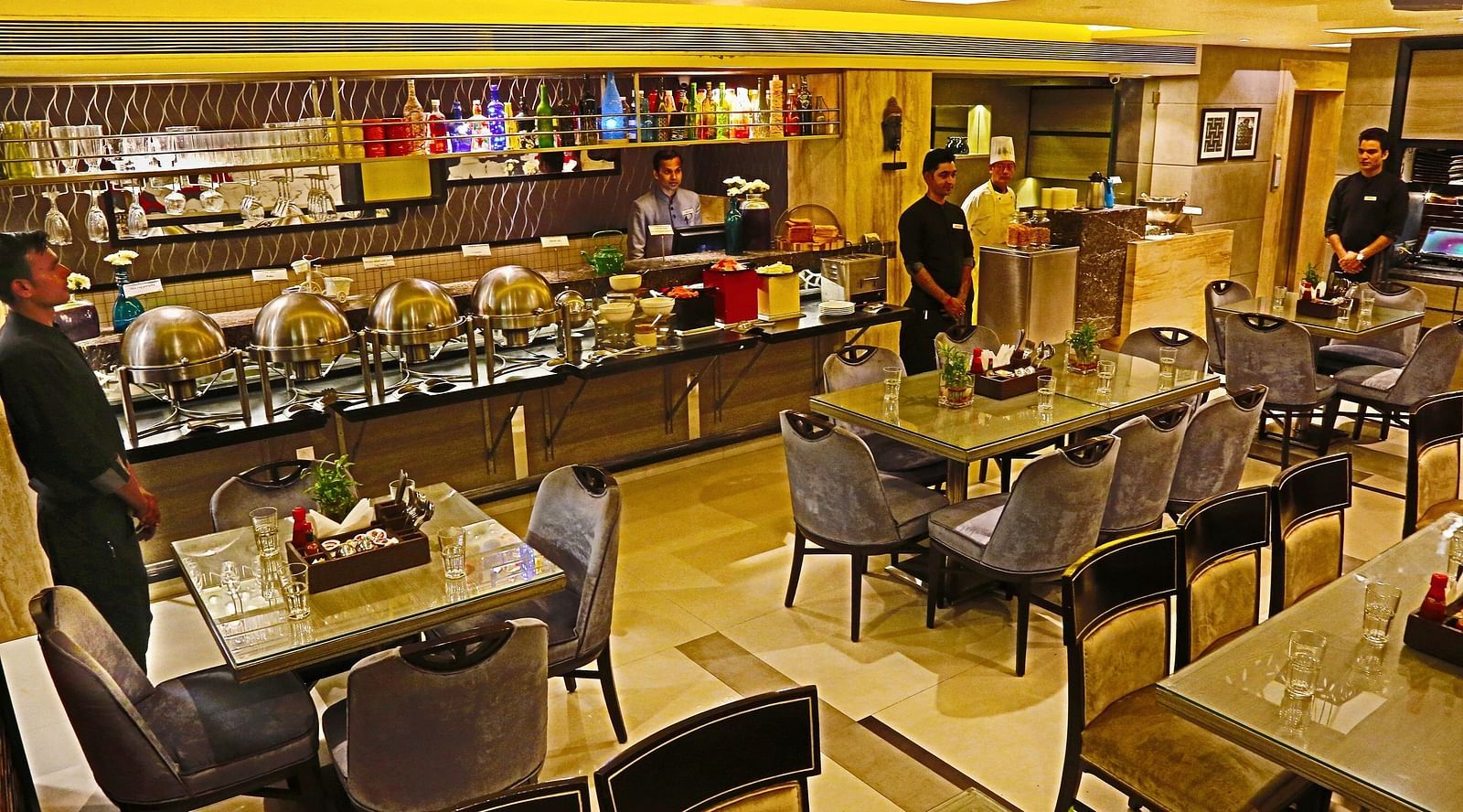 Image of a dining space with chairs and tables at The Oriental Residency
