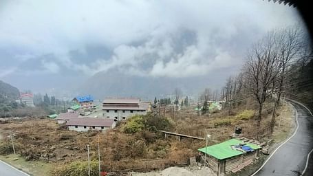 View of buildings and mountains from a balcony of our hotel