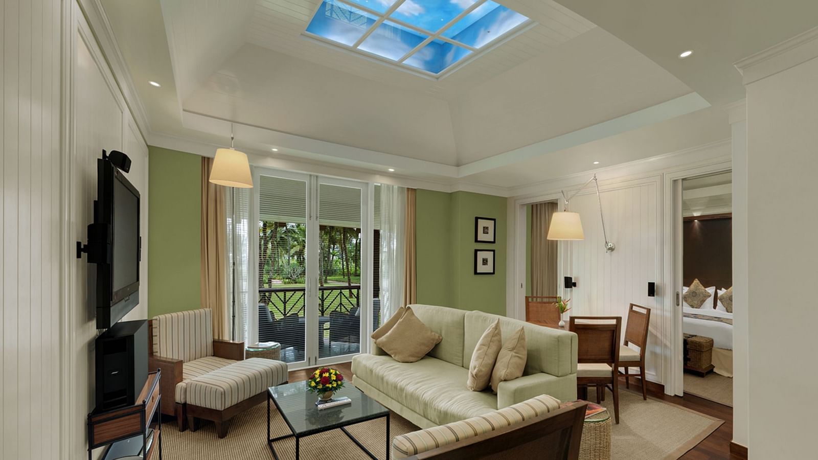 overview of the living room with sofas and table inside Presidential Villa - Caravela Beach Resort Goa