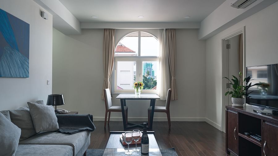 A living room, highlighting the window and the seating area | One-bedroom Suite | Central Mansions, Phnom Penh